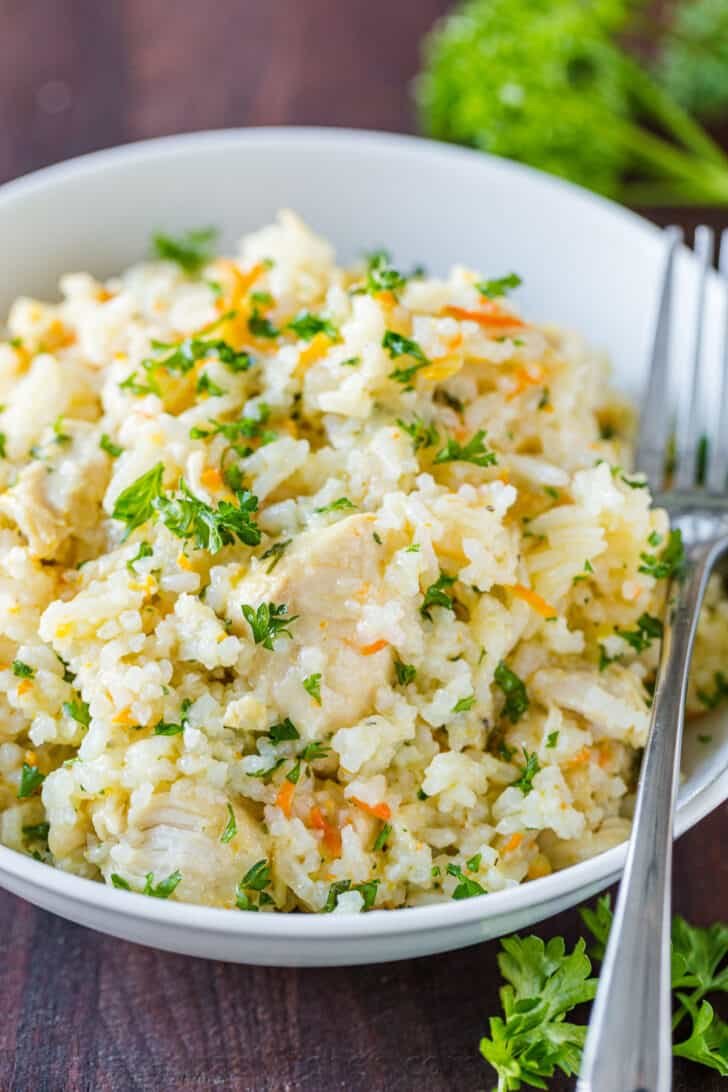 Chicken and Rice from Instant Pot in a bowl garnished with parsley