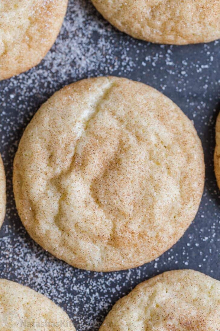 A classic Snickerdoodle Cookies Recipe. These snickerdoodles are soft, sweet, slightly chewy, and coated with cinnamon sugar. up close snicker doodle cookie coated in cinnamon sugar
