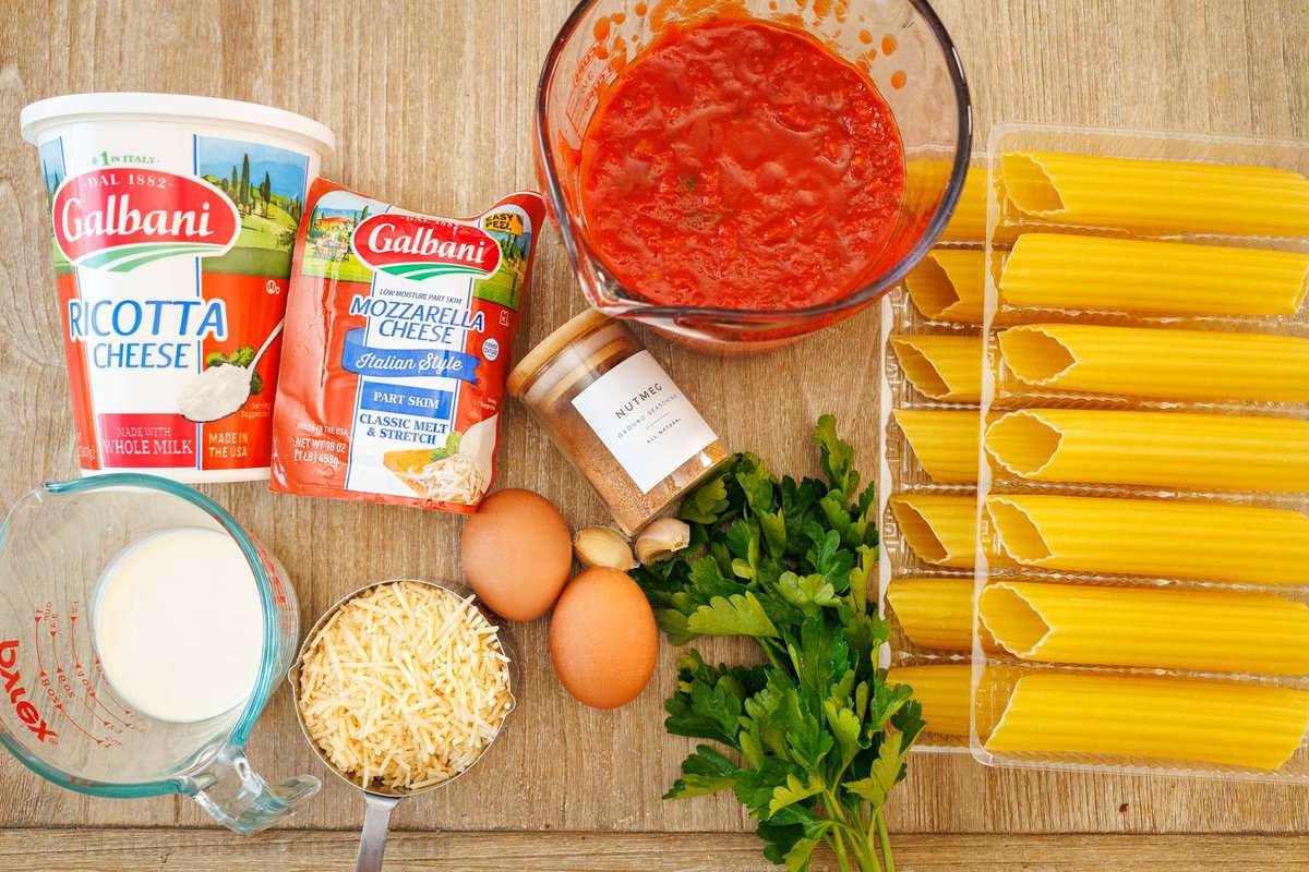 Our Stuffed Manicotti recipe has three delicious cheeses stuffed into perfectly cooked pasta, smothered in marinara sauce and baked perfectly. Ingredients for manicotti pasta including ricotta cheese, mozzarella cheese, nutmeg, marinara, parsley, heavy cream and Parmesan cheese