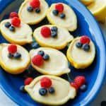 Citrus custard dessert served with berries on top