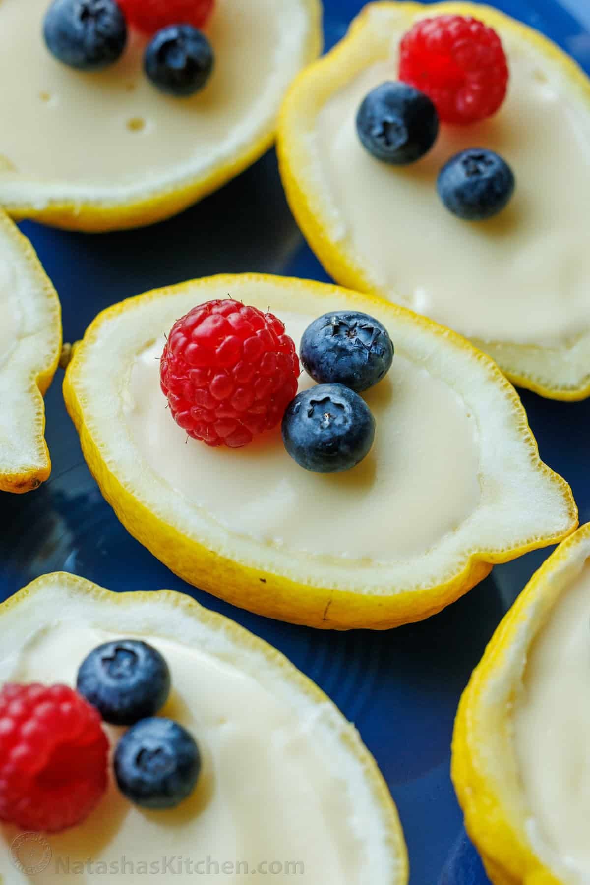 My 3-ingredient Lemon Posset recipe is a velvety smooth lemon custard. It's the perfect make-ahead dessert and cooks in 5 minutes on the stove Lemon posset custard served in a lemon cup garnished with raspberries and blueberries
