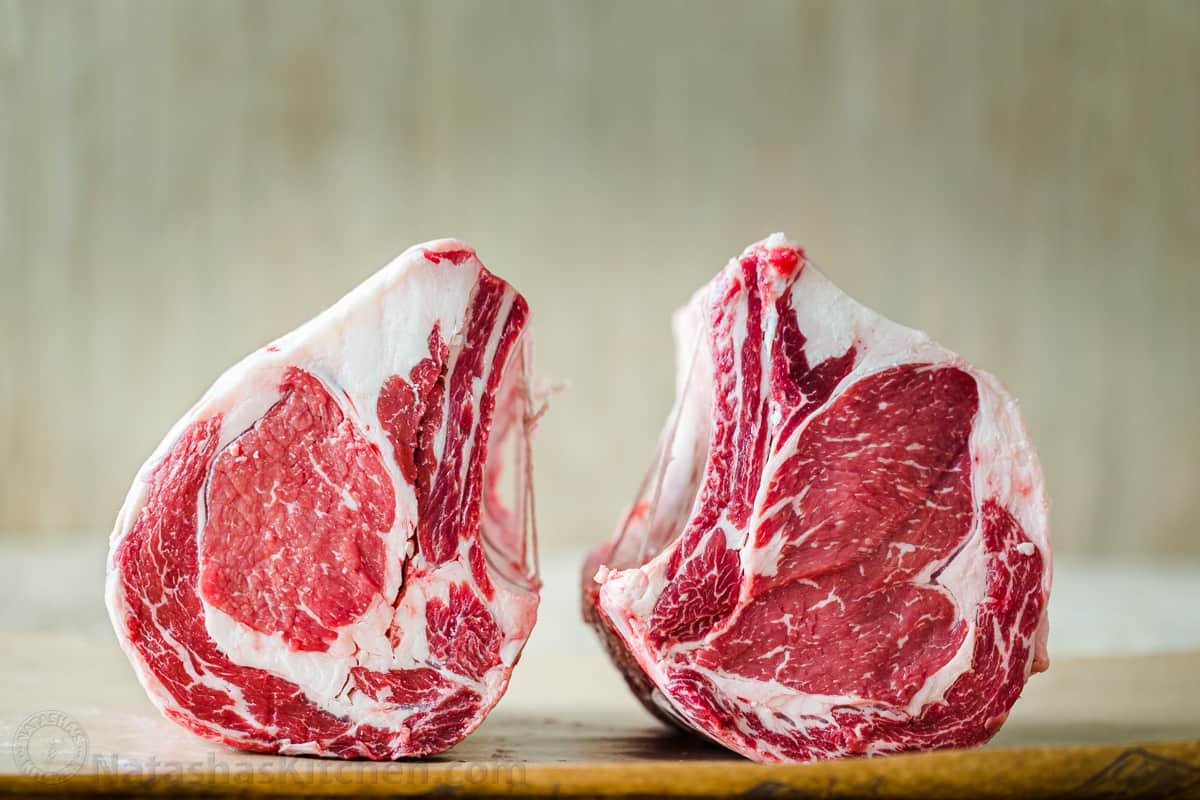 Everything you need to know to purchase the perfect Prime Rib Roast, from beef quality grades, bone-in vs boneless, and how big of a roast you need. Chuck end prime rib and loin end prime rib cuts