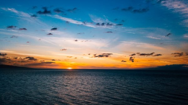 A sunset over a body of water