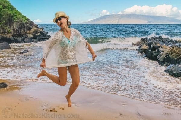 Natasha jumping up by the ocean