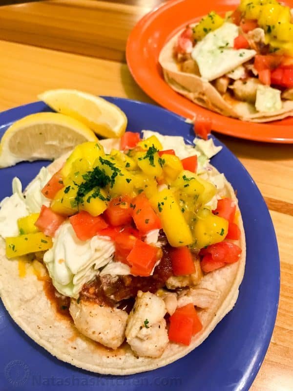 A blue plate with a taco on it