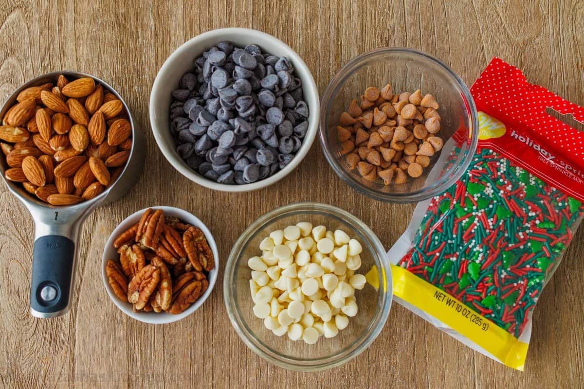 Our toffee recipe is buttery and crunchy with delicious layers of candy, chocolate and almonds. It's easy to make with only 5 ingredients. Toppings for holiday candy such as almonds, butterscotch chips, white chocolate chips, chocolate chips, pecans and holiday sprinkles