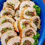 Stuffed Pork Tenderloin sliced into rings on platter
