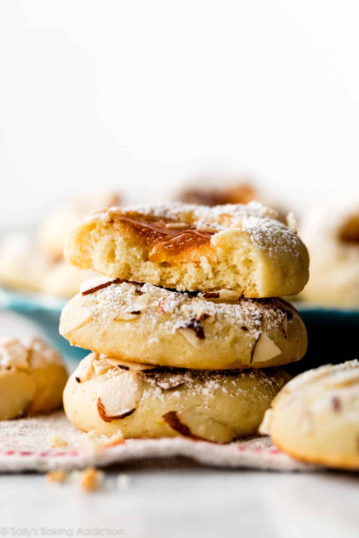 a stack of 3 cream cheese apricot jam cookies