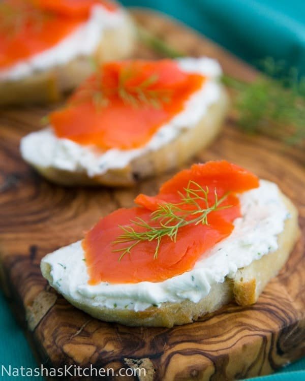 These smoked salmon tea sandwiches (crostini) show up at 90% of our parties. Everyone loves them. The cream cheese dill spread is wonderful!