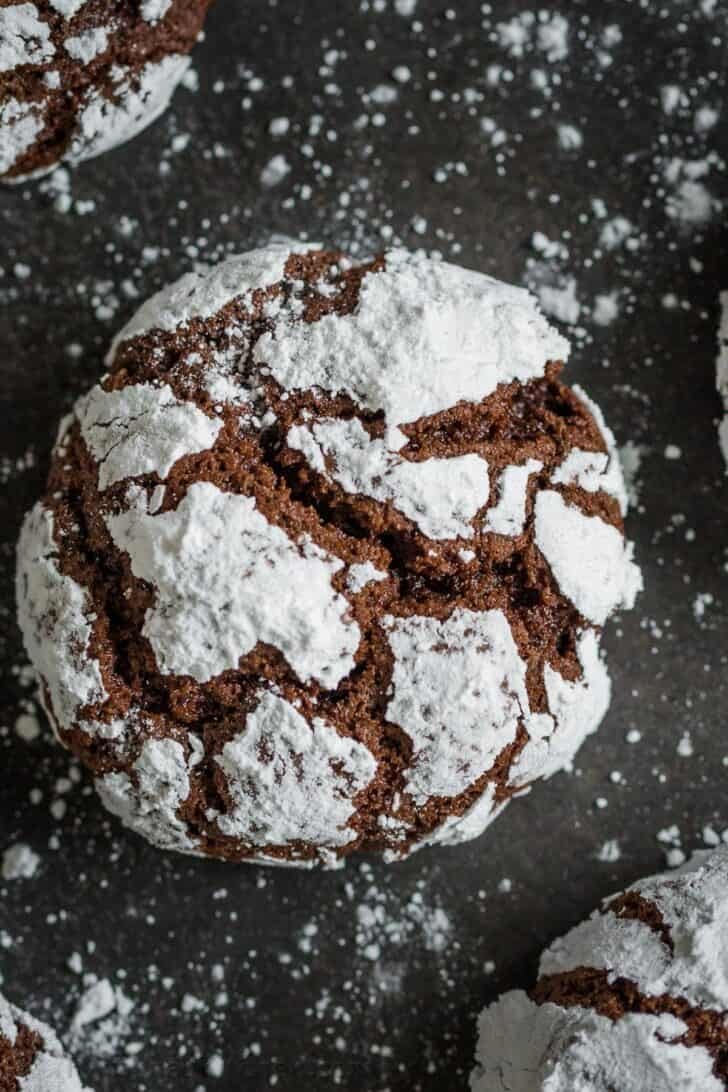 Chocolate Crinkle Cookies have a rich fudgy center with a crisp outer layer. Crinkle Cookies are a staple on the Christmas cookie tray. Chocolate Crinkle Cookie Up close with crinkles