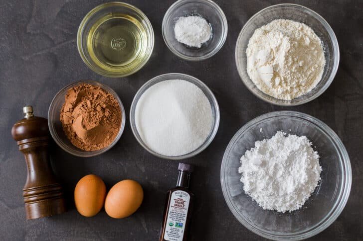 Chocolate Crinkle Cookies are like a cross between the gooiest brownie you have ever had and a crispy chocolate chip cookie Ingredients for crinkle cookies with flour, cocoa powder, sugar, eggs, vanilla, oil