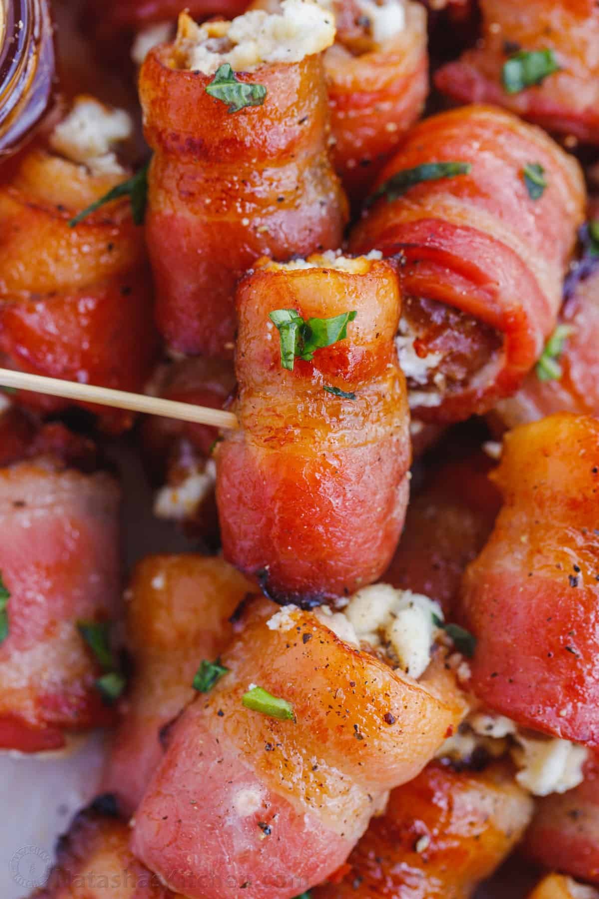 Goat cheese stuffed dates wrapped with bacon. Stuffed Dates wrapped in crispy bacon served with a toothpick