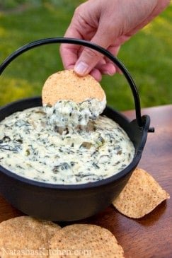 The best spinach and artichoke dip recipe served with tortilla chips in a bowl