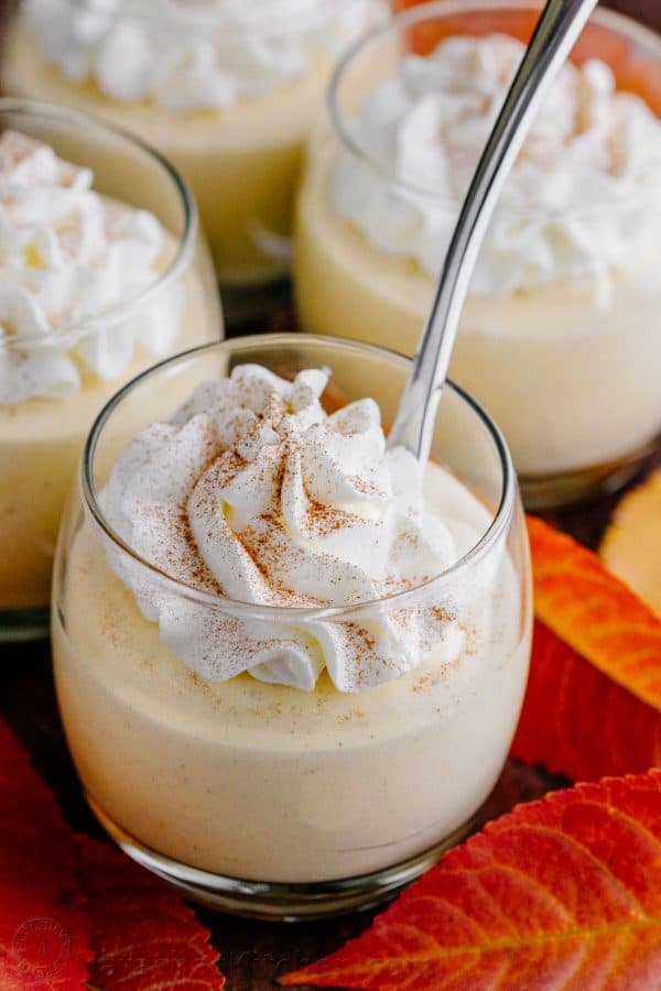 Pumpkin mousse cups have the taste and texture of whipped pumpkin pie. Smooth and airy pumpkin mousse recipe with the best rum-infused whipped cream! | natashaskitchen.com