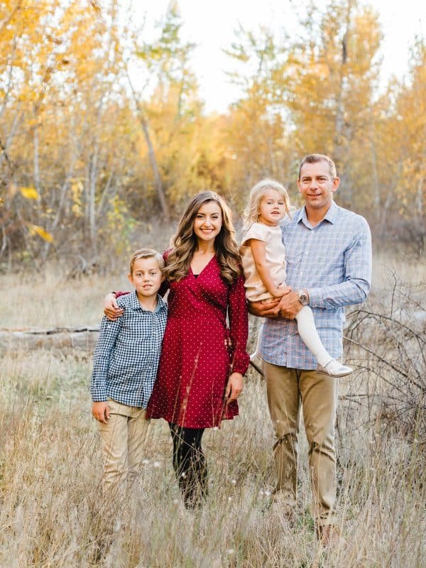 A family posing in the grass