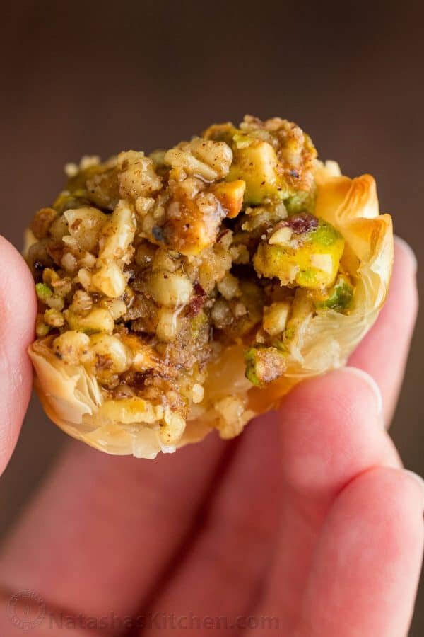 Mini Baklava Cups taste like authentic baklava but easier! The honey and lemon syrup make these baklava cups completely irresistible. A make-ahead recipe! | natashaskitchen.com