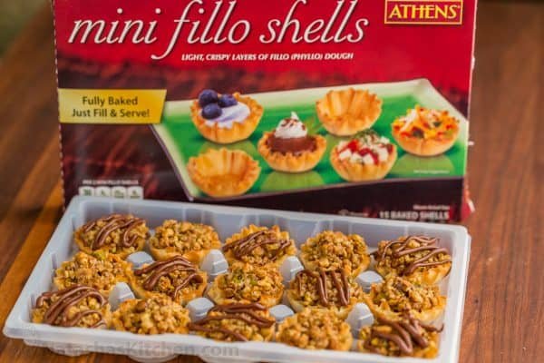 Mini Baklava Cups taste like authentic baklava but easier! The honey and lemon syrup make these baklava cups completely irresistible. A make-ahead recipe! | natashaskitchen.com