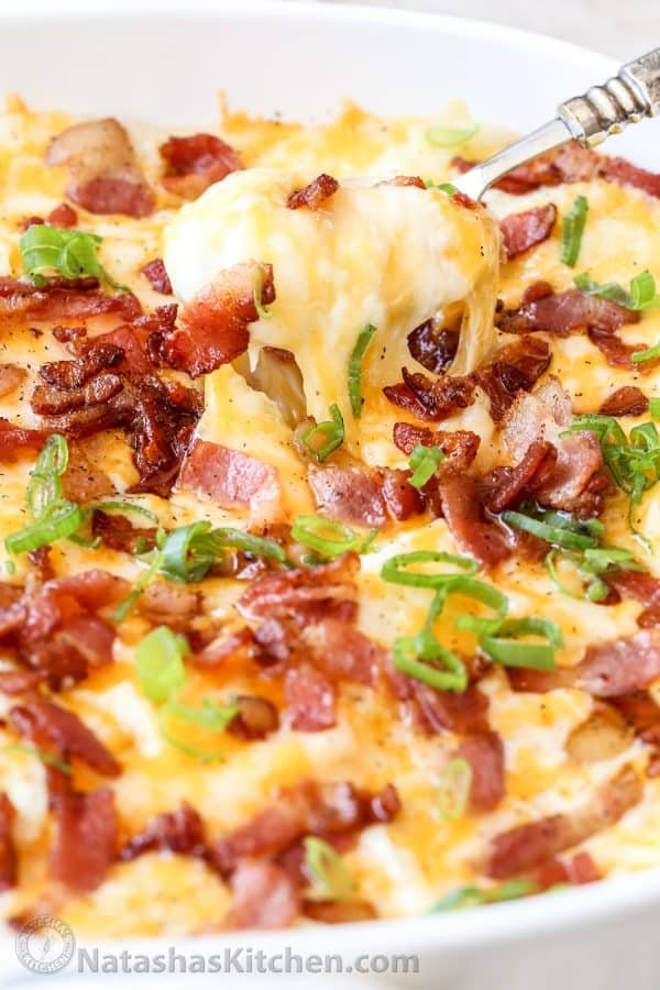 Baked mashed potatoes topped with bacon and chives