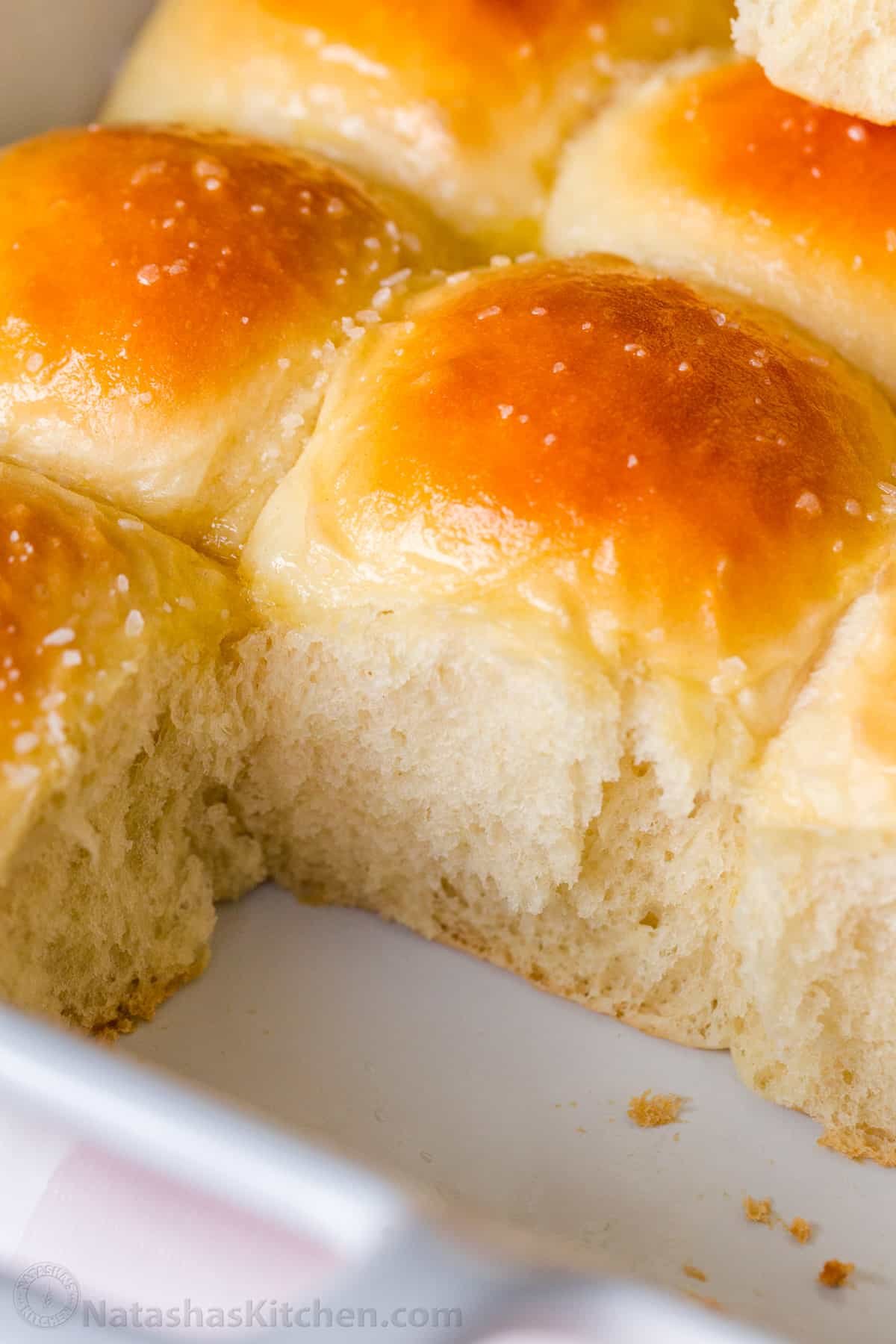 Irresistibly Soft Dinner Rolls are easy to make with just 6 ingredients. There's nothing like fluffy warm homemade dinner rolls. These are holiday worthy! #dinnerrolls #softdinnerrolls #homemadedinnerrolls #easydinnerrolls #howtomakedinnerrolls #natashaskitchen soft dinner rolls at room temperature ready for freezing