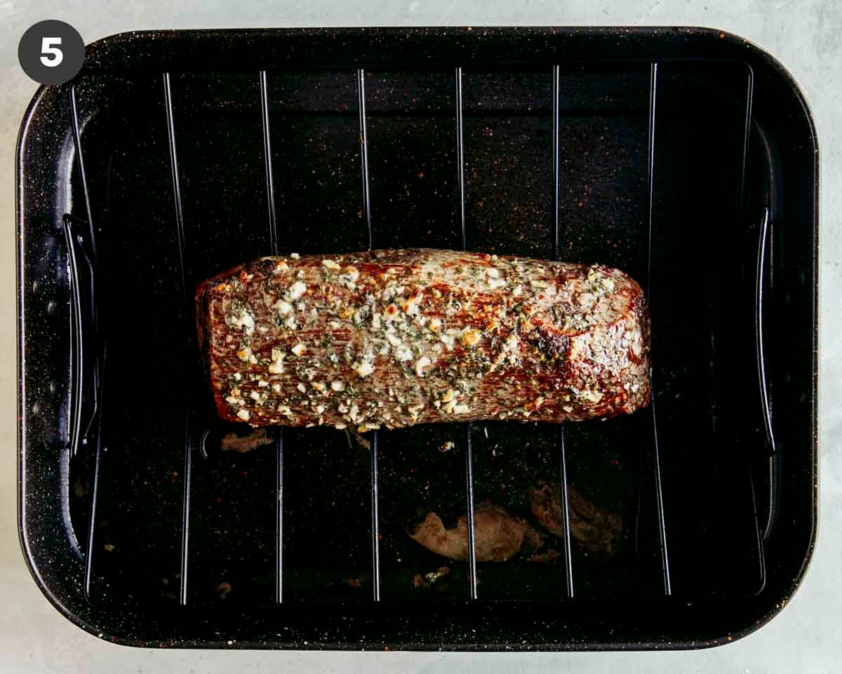 Roast beef roasted in a pan resting.