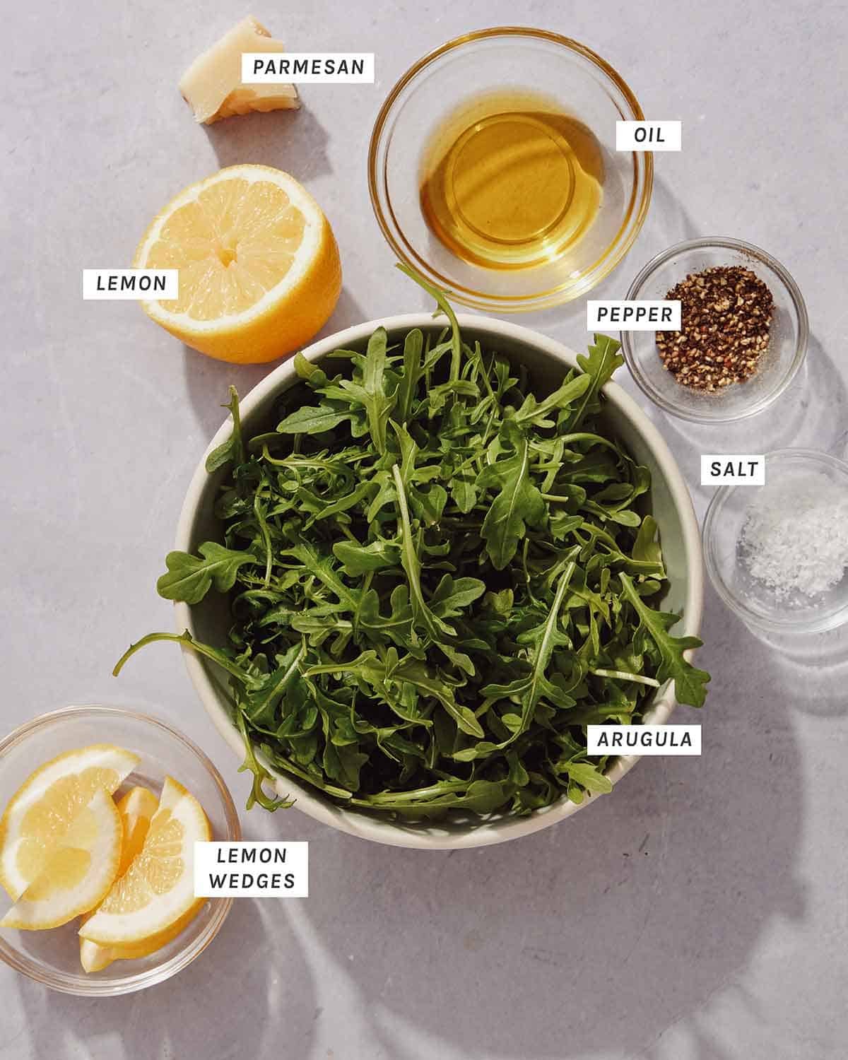 Ingredients for an arugula salad that goes on top of chicken milanese.