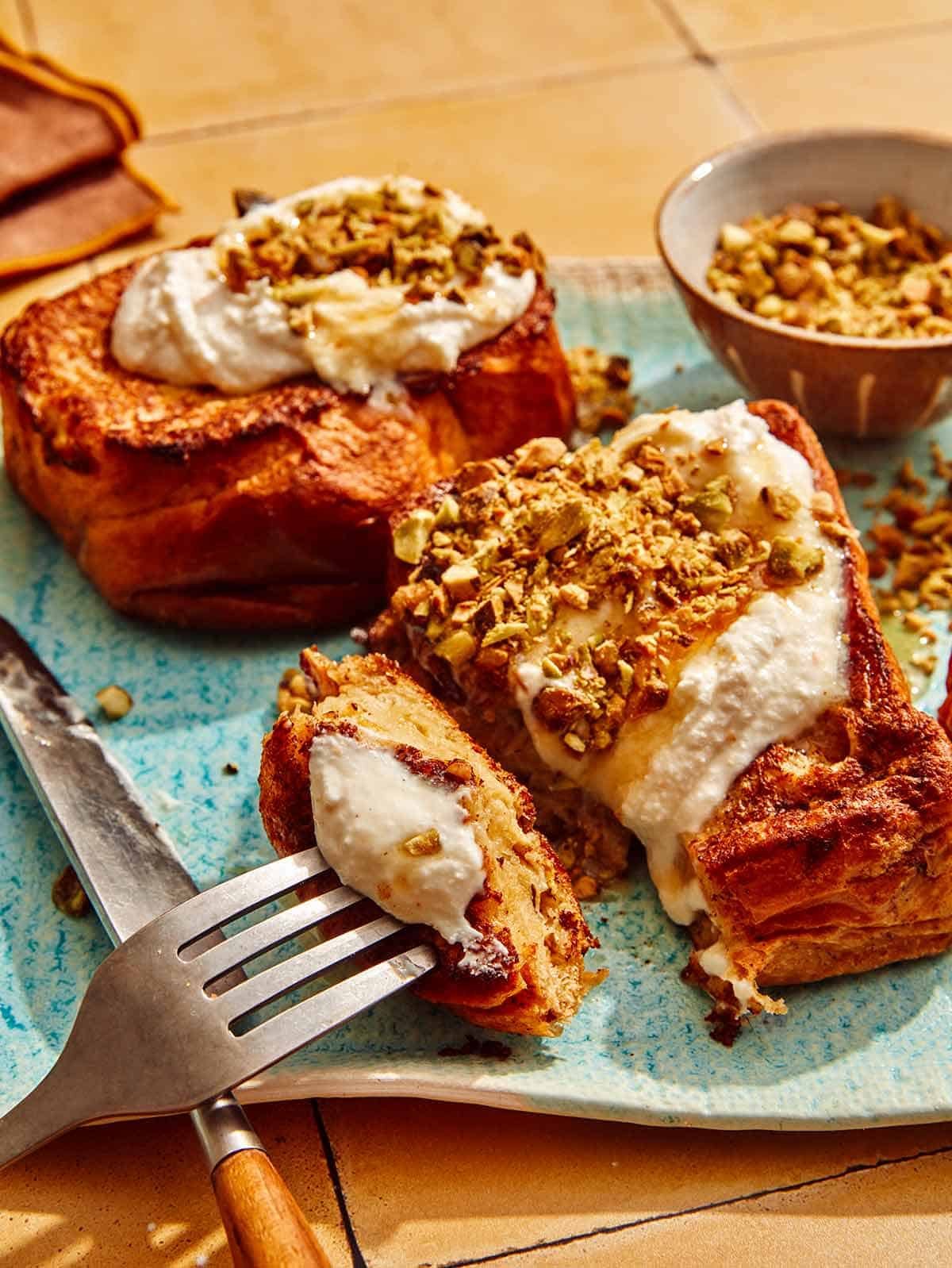 A thick piece of french toast with a bite cut out of it.