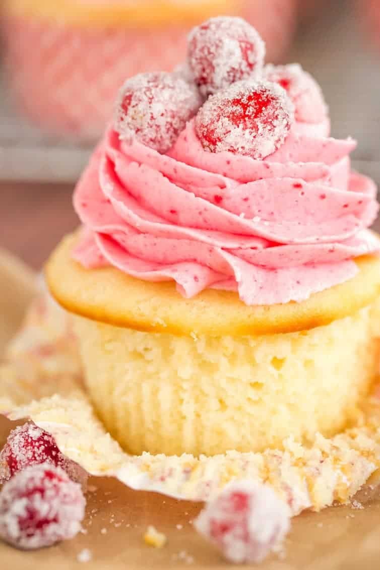 Sparkling Cranberry White Chocolate Cupcakes - Vanilla cupcakes with white chocolate ganache filling and cranberry buttercream frosting. | browneyedbaker.com