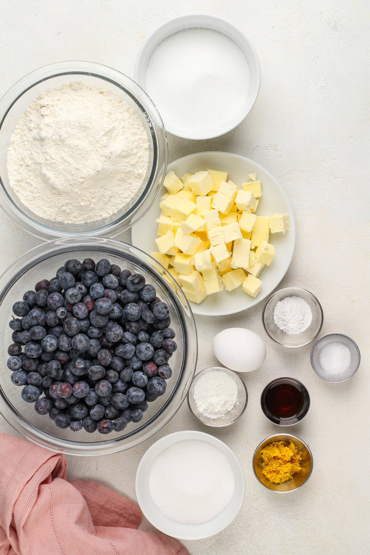 Ingredients for blueberry crumb bars arranged on a countertop.