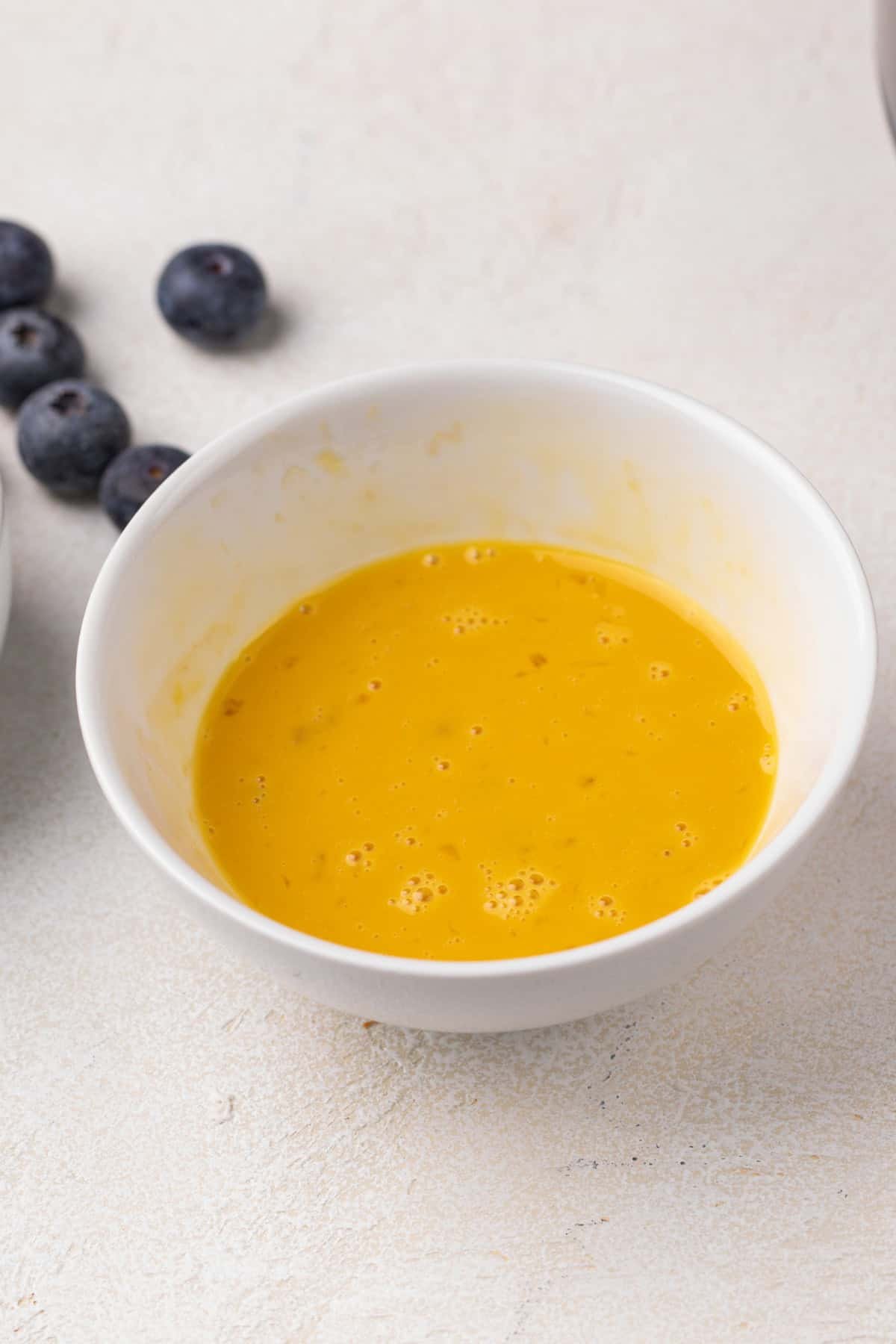 Whisked egg and vanilla.