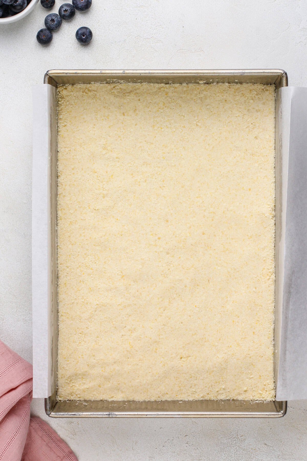 Crust for crumb bars pressed into the bottom of a pan.