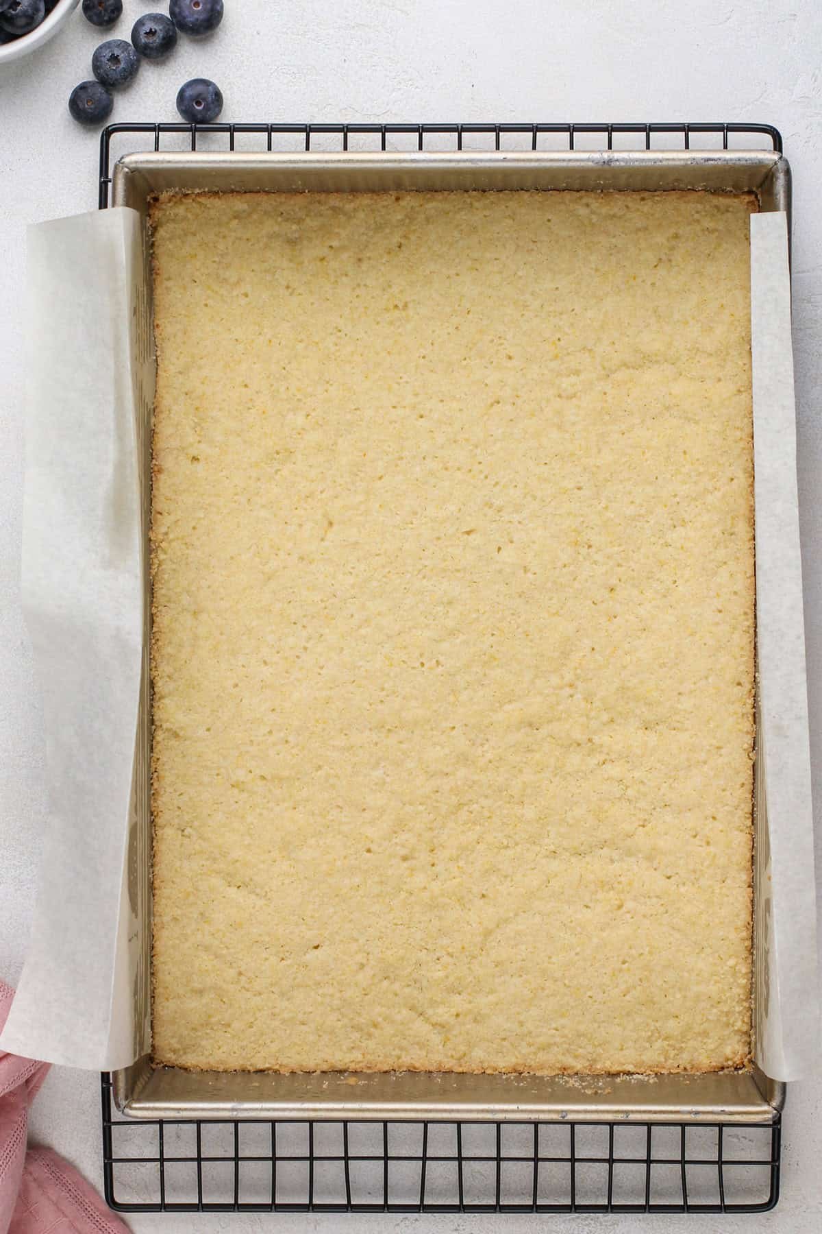 Baked crumb bar crust in a pan.