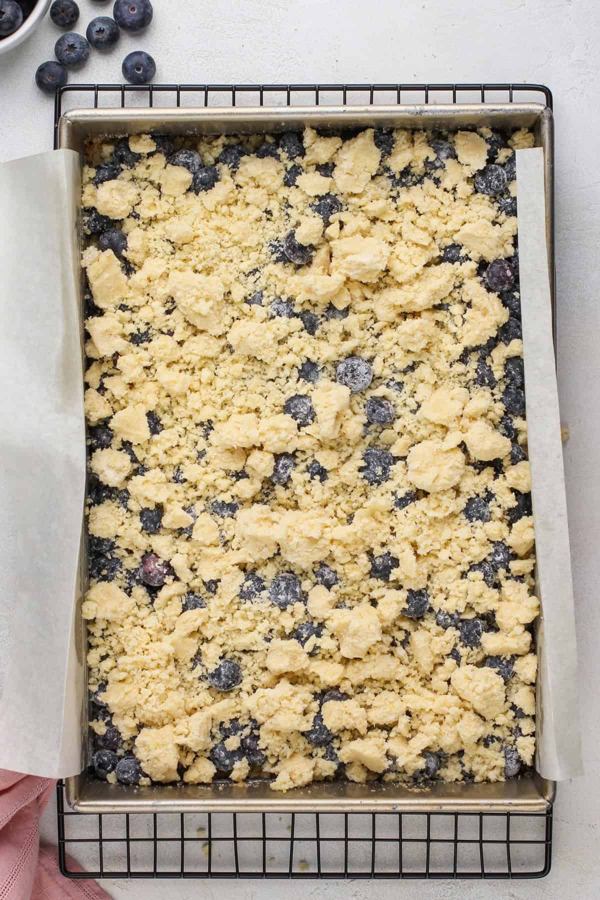 Assembled blueberry crumb bars ready to go in the oven.