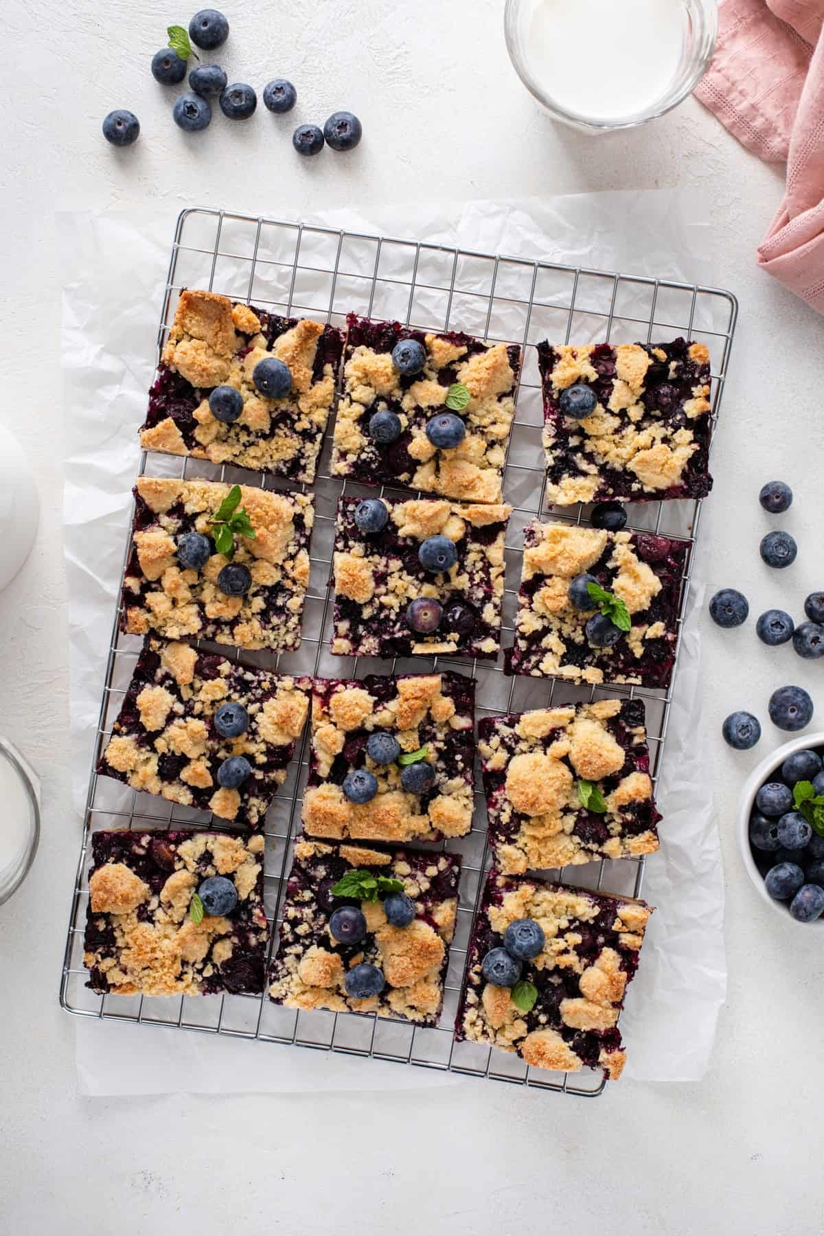 Overhead view of sliced blueberry crumb bars.