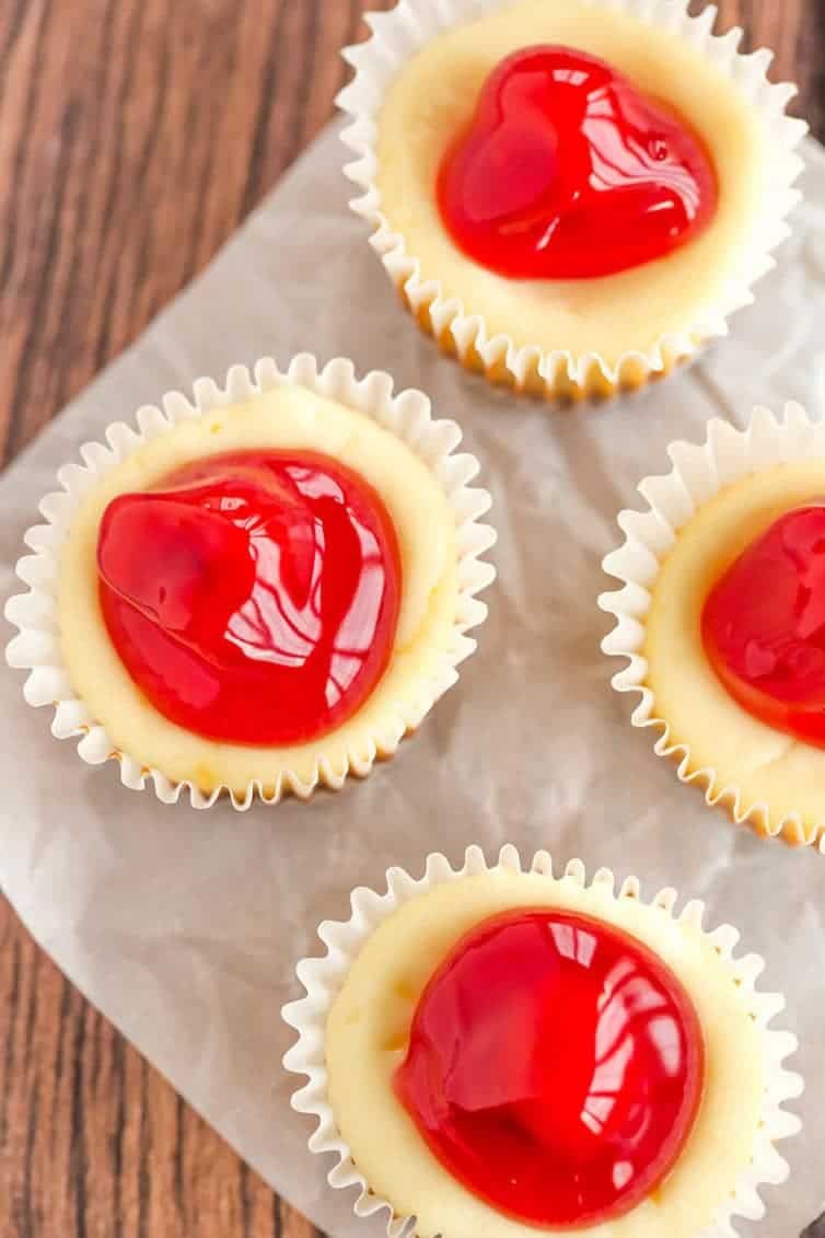 These easy mini cheesecakes have been a holiday staple in my family forever! Nilla wafers are topped with cheesecake batter and cherry pie filling. A perfect bite-size treat!
