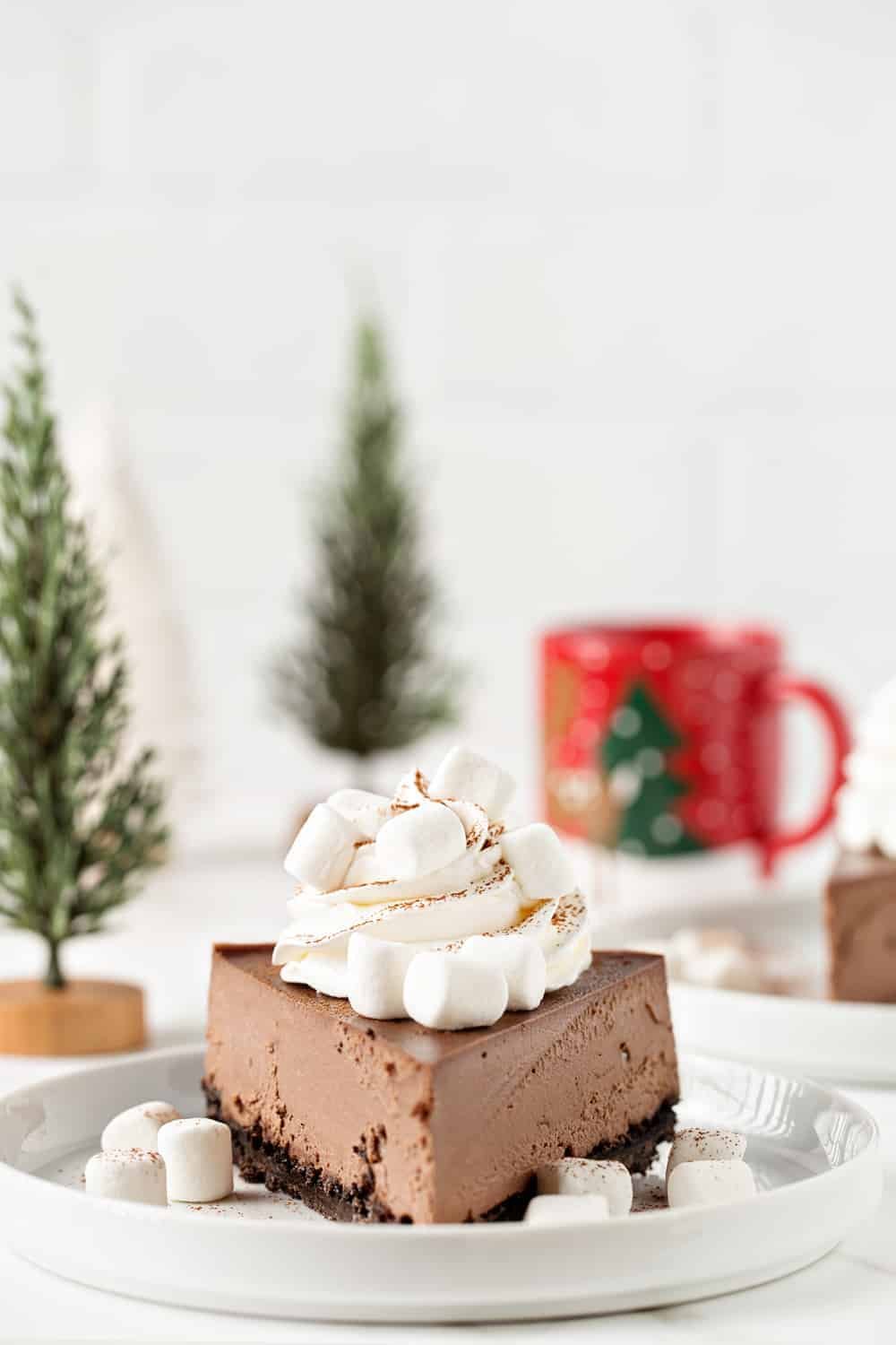 This Hot Cocoa Cheesecake is the perfect dessert for any holiday party. Everyone will be begging you for the recipe!