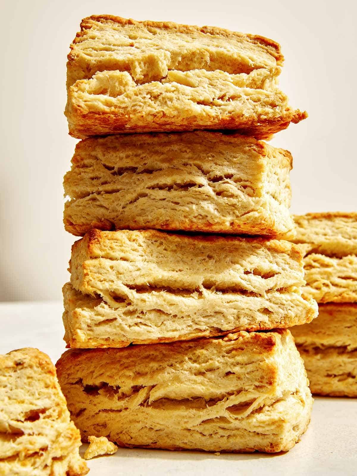 A stack of buttermilk biscuits in a kitchen.