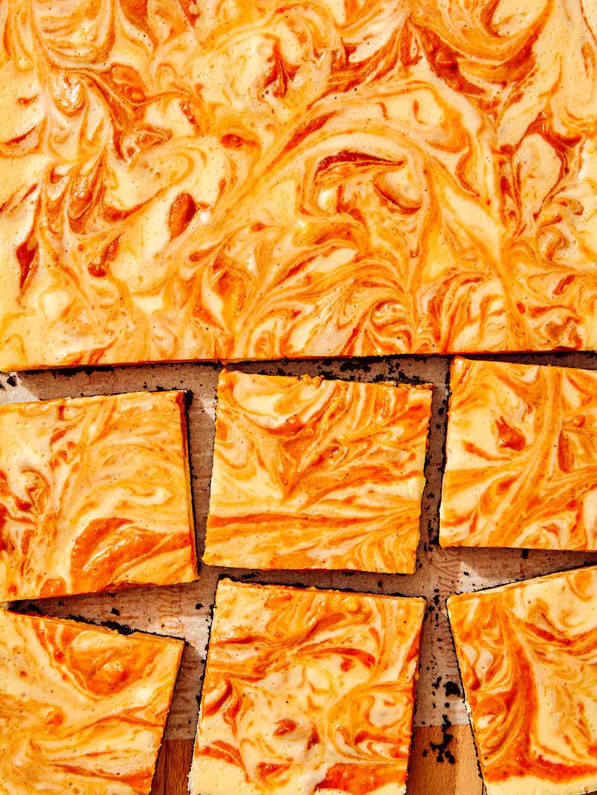 Close up on pumpkin pie cheesecake bars.