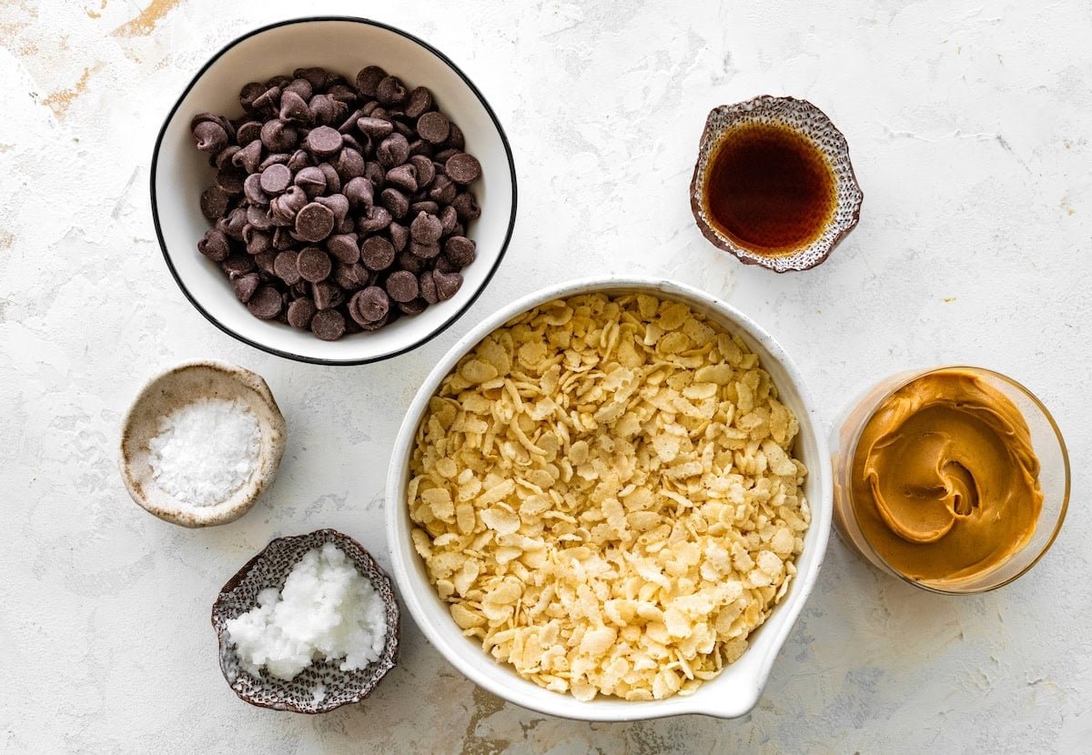 ingredients in bowls to make chocolate crunch bars.