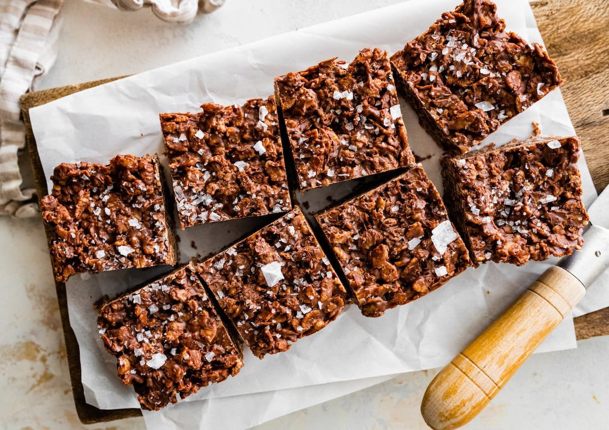 chocolate crunch bars cut into squares with knife.