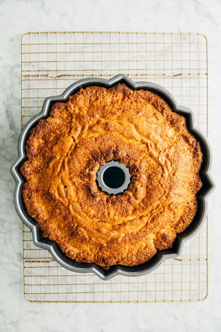 photo showing the baked coconut bundt cake still in the cake pan before being turned out