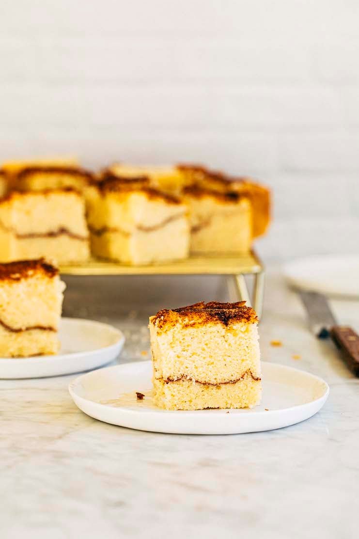 photo of a slice of snickerdoodle cake on a white plate