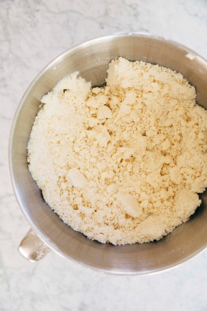 Photo showing the coarse meal texture of the dry ingredients after being mixed with the butter
