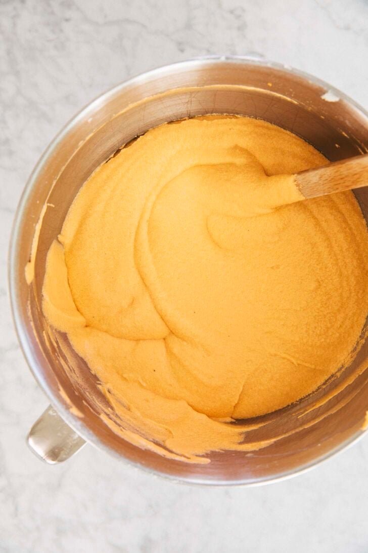 photo of the cake batter after the eggs and milk have been added and it's ready to be poured into cake pans