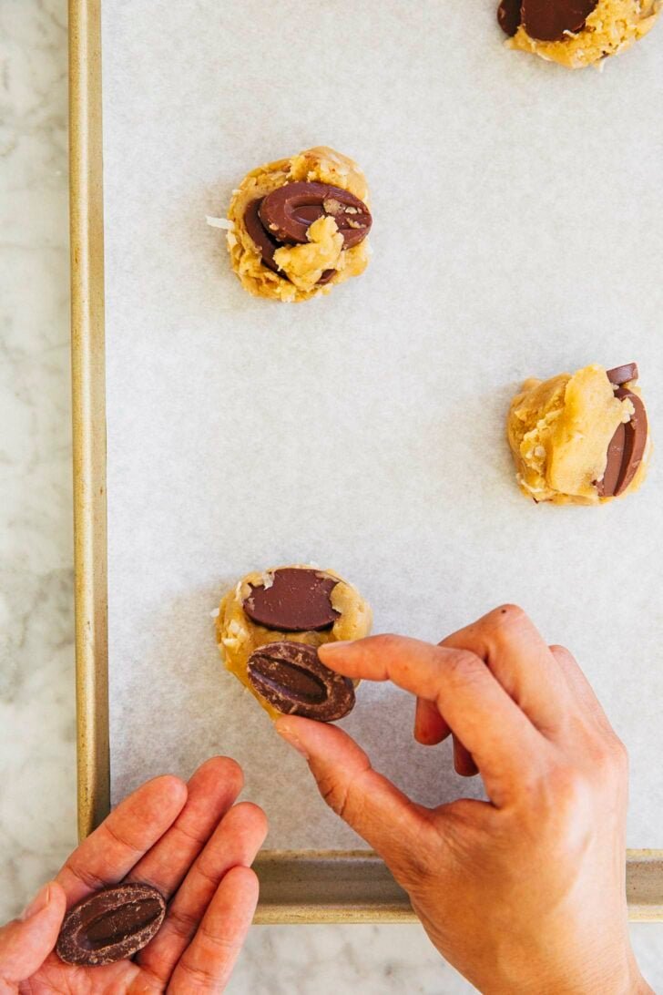 photo of Michelle from Hummingbird High styling the coconut chocolate chip cookie dough balls with extra chocolate feves