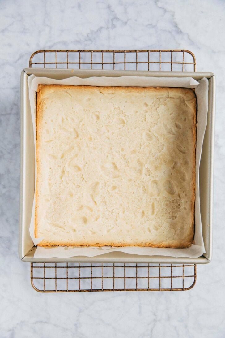 Photo of the baked shortbread layer before being filled with the pistachio kataifi filling and chocolate ganache