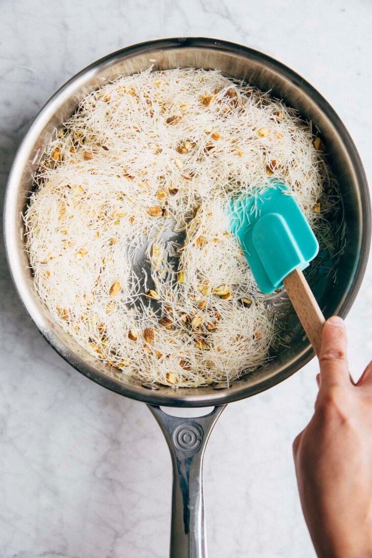 Photo showing Michelle from Hummingbird High tossing the kataifi in melted butter