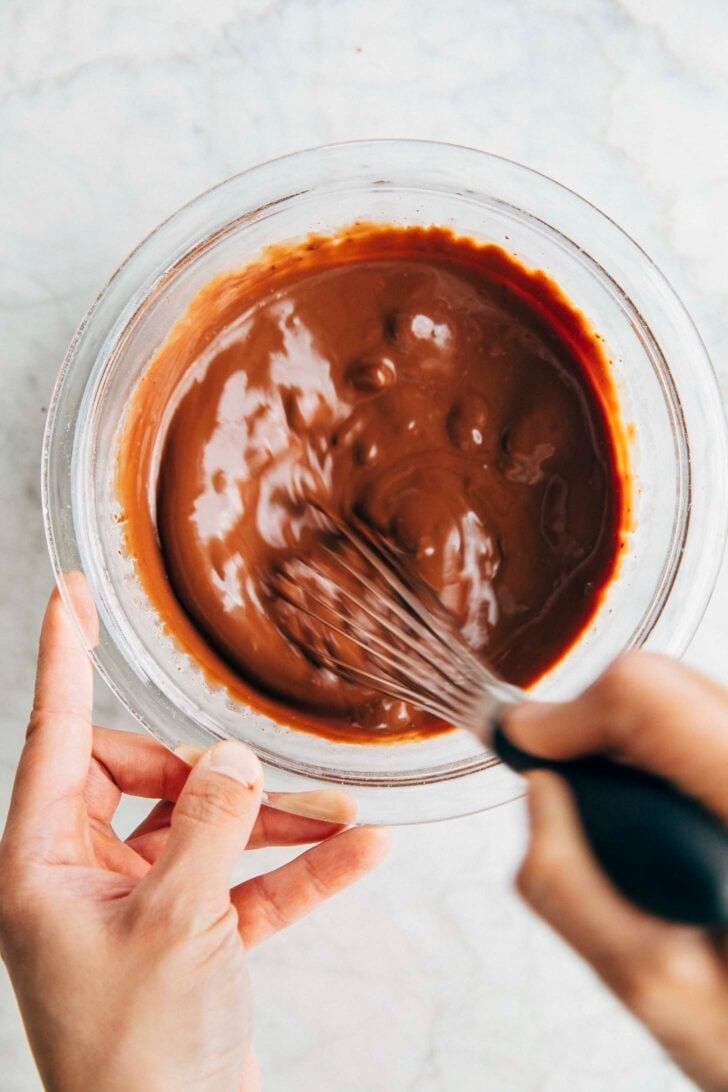 Photo of the cream and chocolate turning into a thick chocolate ganache