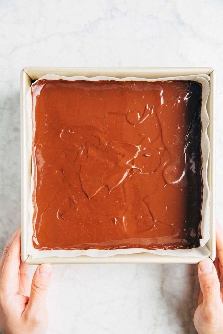 Photo of the ganache completely covering the pistachio kataifi layer