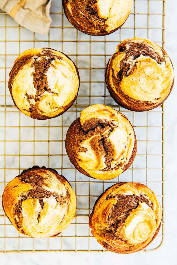 photo of pumpkin cream cheese muffins on gold wire rack