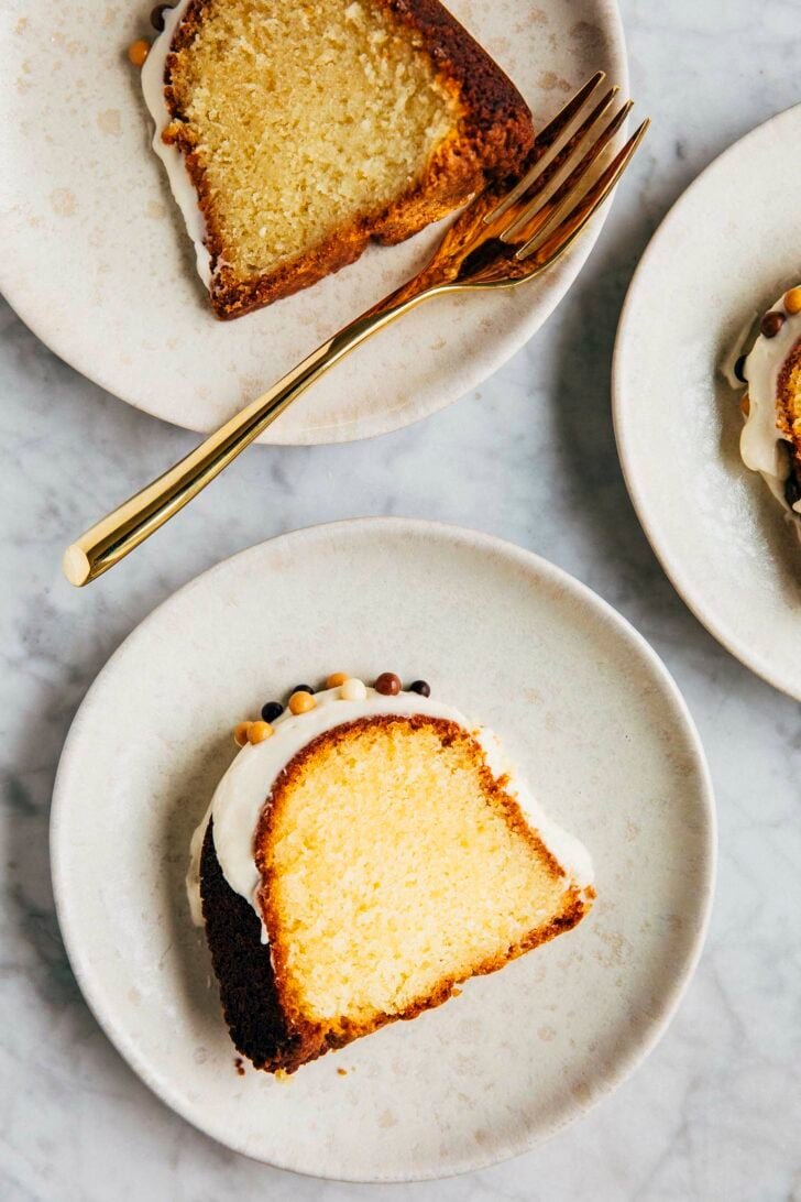 photo of slices of banana pudding bundt cake on small beige plates